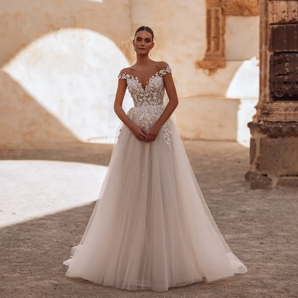 Illusion Neck Tulle A-line Appliques Boho Wedding Party Dress Lace A-line Backless Bridal Dress with Train Custom Made Vestidos
Illusion Neck Tulle A-line Appliques Boho Wedding Party Dress Lace A-line Backless Bridal Dress with Train Custom Made Vestidos