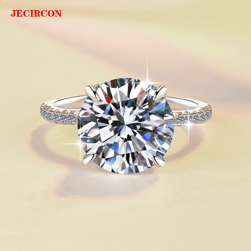 JECIRCON S925 Sterling Silver Moissanite Ring for Women 3CT/5CT Brilliant Cut Pigeon Egg Wedding Jewelry Fashion Banquet Gift
JECIRCON S925 Sterling Silver Moissanite Ring for Women 3CT/5CT Brilliant Cut Pigeon Egg Wedding Jewelry Fashion Banquet Gift