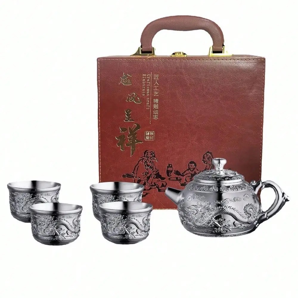Alloy Tea Set Dragon And Phoenix Design Tea Set. A Creative Gift For Home Use, Including A Teapot And Silver Teacups. Suitable
Alloy Tea Set Dragon And Phoenix Design Tea Set. A Creative Gift For Home Use, Including A Teapot And Silver Teacups. Suitable