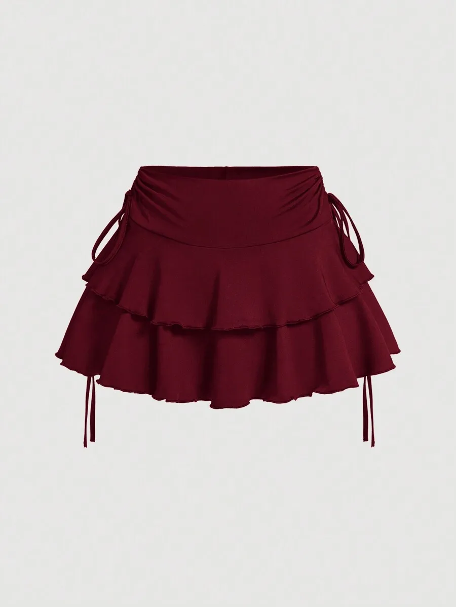 Бордовая многоярусная юбка с рюшами и завязками по бокам, мини-длина, повседневный шик
Бордовая многоярусная юбка с рюшами и завязками по бокам, мини-длина, повседневный шик