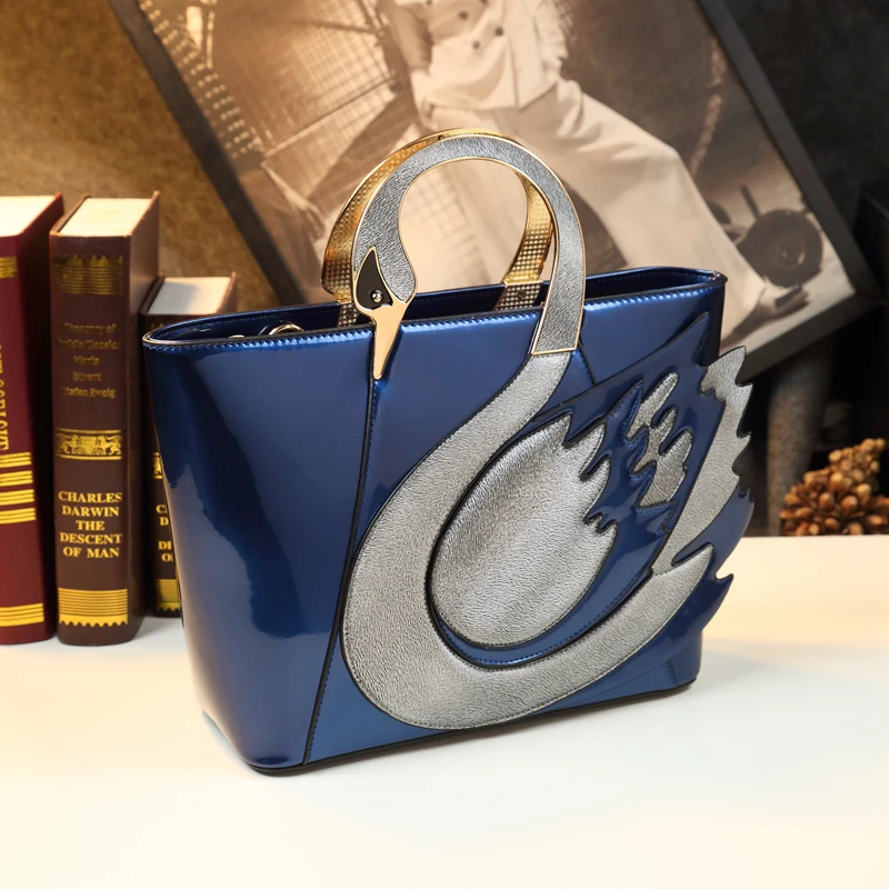 Autumn new leather bag swan embroidery hand-held messenger mother bag large-capacity dress all-match shoulder bag women
Autumn new leather bag swan embroidery hand-held messenger mother bag large-capacity dress all-match shoulder bag women