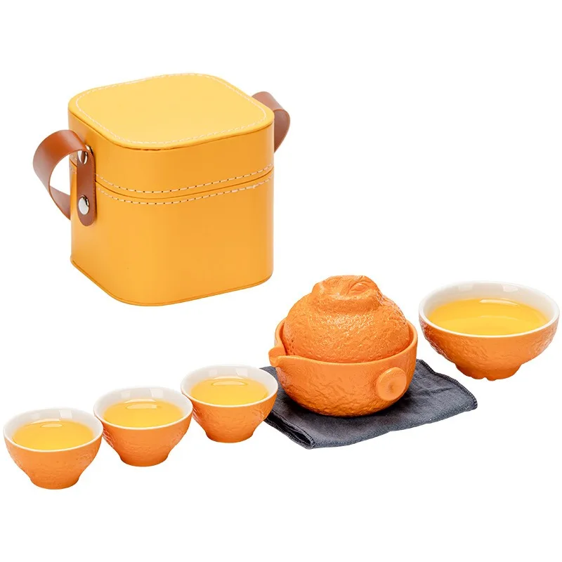 A pot of four cups of ceramic travel tea set, a small set of portable storage leather boxes, as a gift.
A pot of four cups of ceramic travel tea set, a small set of portable storage leather boxes, as a gift.