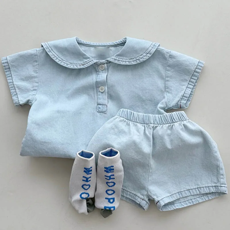 2026 Summer New Baby Short Sleeve Clothes Set Boys Girls Loose Lapel Denim T Shirts + Shorts 2pcs Suit Solid Toddler Outfits
2026 Summer New Baby Short Sleeve Clothes Set Boys Girls Loose Lapel Denim T Shirts + Shorts 2pcs Suit Solid Toddler Outfits