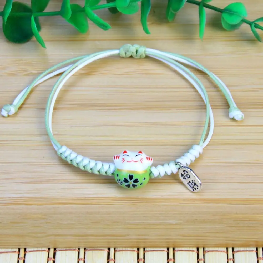 Ceramic Cat Pendant Maneki Neko Bracelet Hand Rope Two Color Red Braided Rope Jewelry Accessories Wax Thread Women Hand Ring
Ceramic Cat Pendant Maneki Neko Bracelet Hand Rope Two Color Red Braided Rope Jewelry Accessories Wax Thread Women Hand Ring
