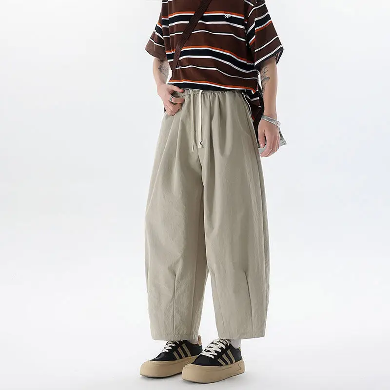 Мужские повседневные брюки с завязками, однотонные свободные мужские брюки с эластичной резинкой на талии и широкими штанинами
Мужские повседневные брюки с завязками, однотонные свободные мужские брюки с эластичной резинкой на талии и широкими штанинами