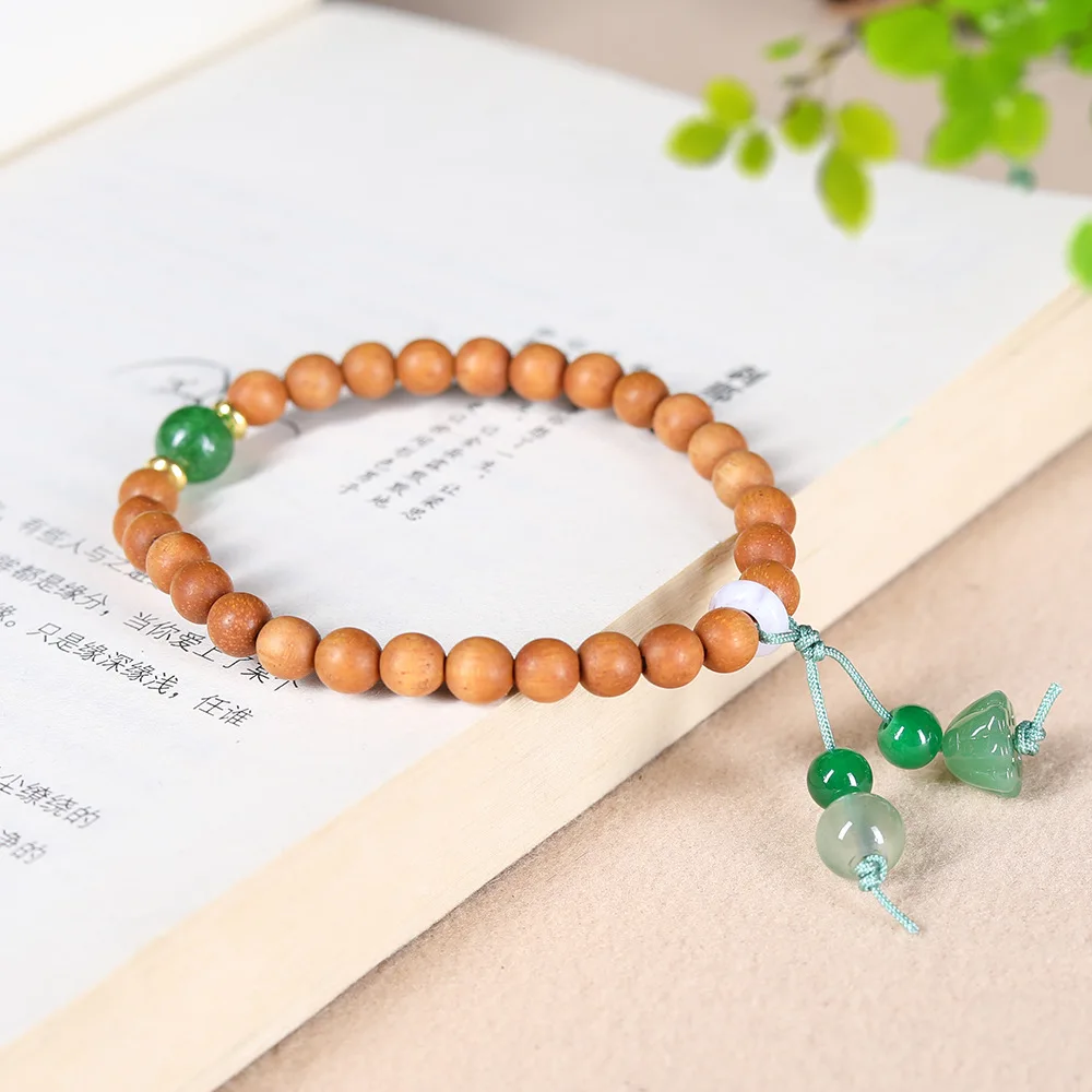 Natural Sandalwood Bracelet for Women with Chinese Style Jade Lotus Pod Pendant Wooden Prayer Bead Bracelet Gifts
Natural Sandalwood Bracelet for Women with Chinese Style Jade Lotus Pod Pendant Wooden Prayer Bead Bracelet Gifts