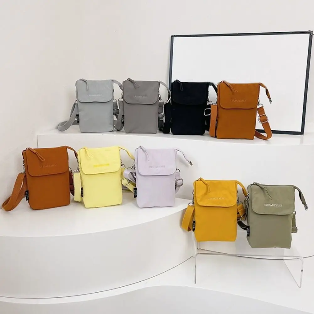 Trendy Nylon Phone Bag Solid Color Ultra Lightweight Crossbody Bag Mini Size Adjustable Strap Shoulder Bag Unisex
Trendy Nylon Phone Bag Solid Color Ultra Lightweight Crossbody Bag Mini Size Adjustable Strap Shoulder Bag Unisex