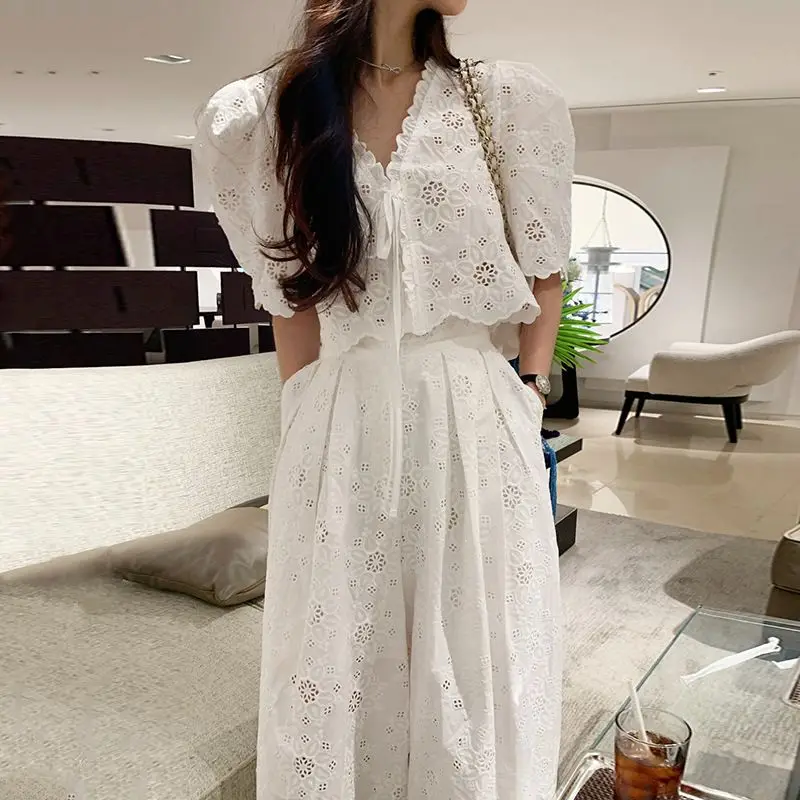 Women's Lace Eyelet Embroidery Two Piece Set V Neck Puff Sleeve Tie Front Crop Top High Waist A-Line Maxi Pants Summer Outfit
Women's Lace Eyelet Embroidery Two Piece Set V Neck Puff Sleeve Tie Front Crop Top High Waist A-Line Maxi Pants Summer Outfit