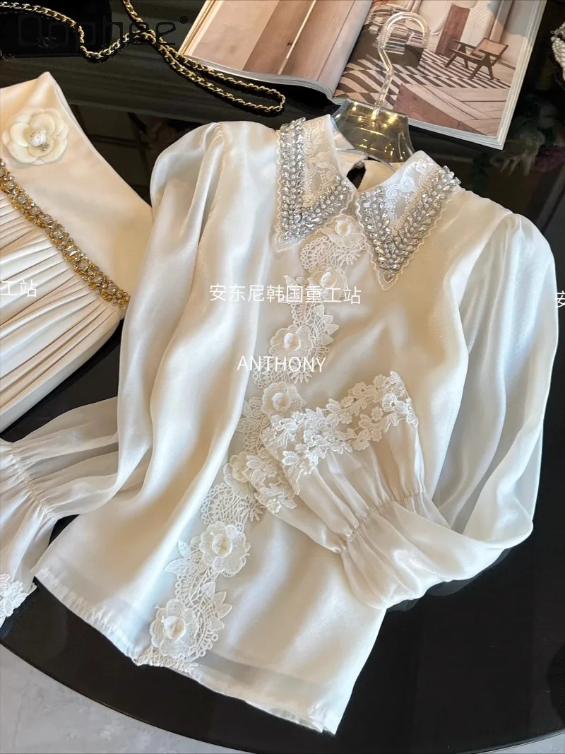 Тяжелая белая рубашка со стразами, осень-зима 2021, новинка во французском стиле, элегантная свободная шифоновая блузка с отложным воротником и расклешенными рукавами
Тяжелая белая рубашка со стразами, осень-зима 2021, новинка во французском стиле, элегантная свободная шифоновая блузка с отложным воротником и расклешенными рукавами