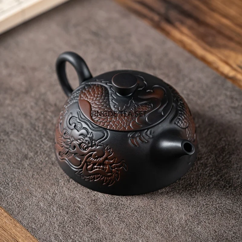 Purple pottery zodiac dragon carving handmade antique relief teapot household teapot Kung Fu tea set teapot
Purple pottery zodiac dragon carving handmade antique relief teapot household teapot Kung Fu tea set teapot