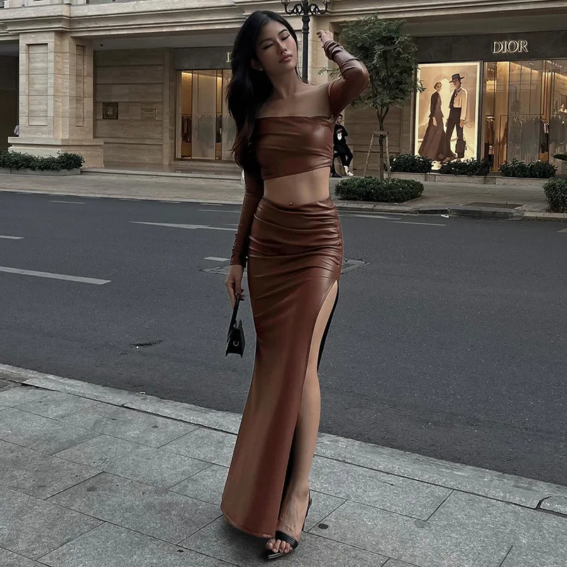 Faux Leather Ruched Women Two Piece Set 2023 Autumn Full Sleeve Diagonal Collar Crop Top Split Long Skirt Party Club Streetwear
Faux Leather Ruched Women Two Piece Set 2023 Autumn Full Sleeve Diagonal Collar Crop Top Split Long Skirt Party Club Streetwear