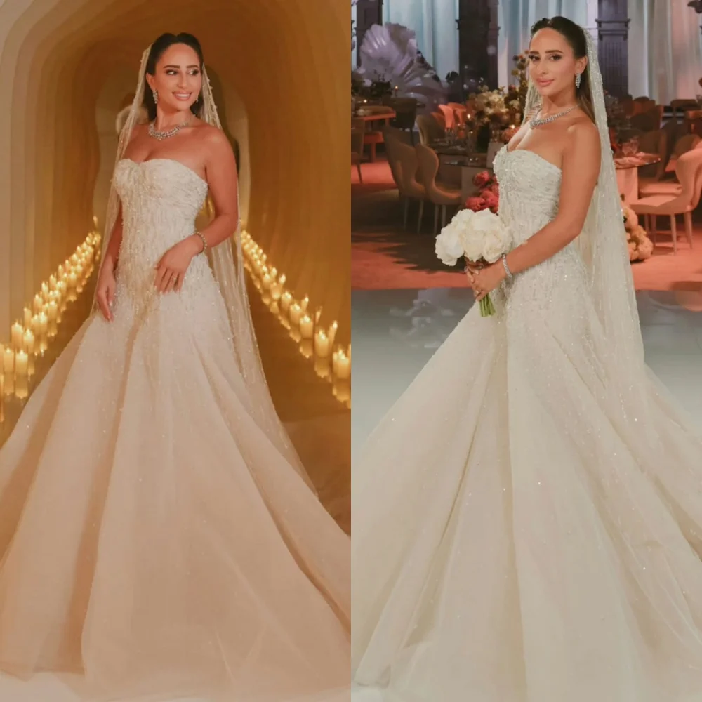 Customized Exquisite White Tulle Bridal Gowns Elegant Strapless Sequined Wedding Dress Chapel Train Open Back Vestido De Novia
Customized Exquisite White Tulle Bridal Gowns Elegant Strapless Sequined Wedding Dress Chapel Train Open Back Vestido De Novia