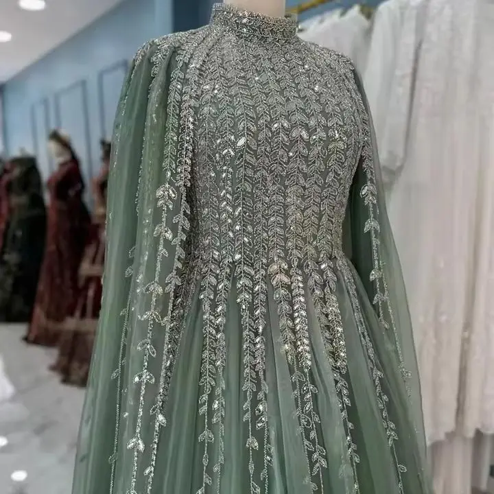 Saudi Arabian Fully Beaded Evening Dress فساتين سهرات Customized Sage Green High Neck Long Cape Sleeves A Line Prom Gown Party
Saudi Arabian Fully Beaded Evening Dress فساتين سهرات Customized Sage Green High Neck Long Cape Sleeves A Line Prom Gown Party