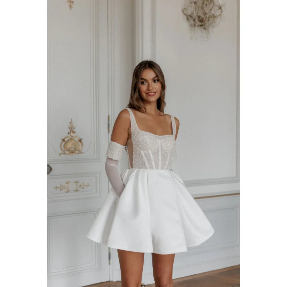 Customized Ivory Spaghetti Strap Beading Pearls Mini Wedding Dresses robes de soirée Satin Backless Party A-line Prom Dress
Customized Ivory Spaghetti Strap Beading Pearls Mini Wedding Dresses robes de soirée Satin Backless Party A-line Prom Dress