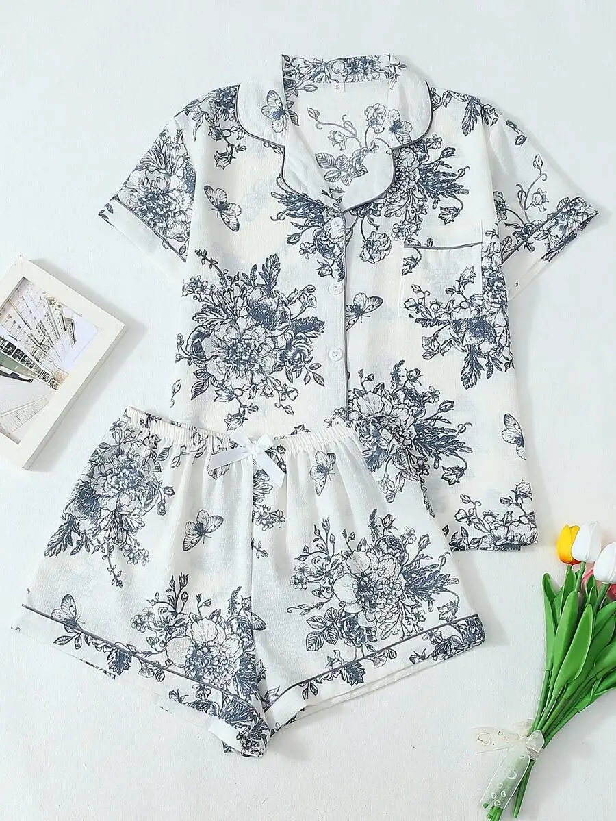 2-Piece Women Floral Print Lapel Button Short Sleeve Pajama Set With Pocket And Bow Shorts
2-Piece Women Floral Print Lapel Button Short Sleeve Pajama Set With Pocket And Bow Shorts