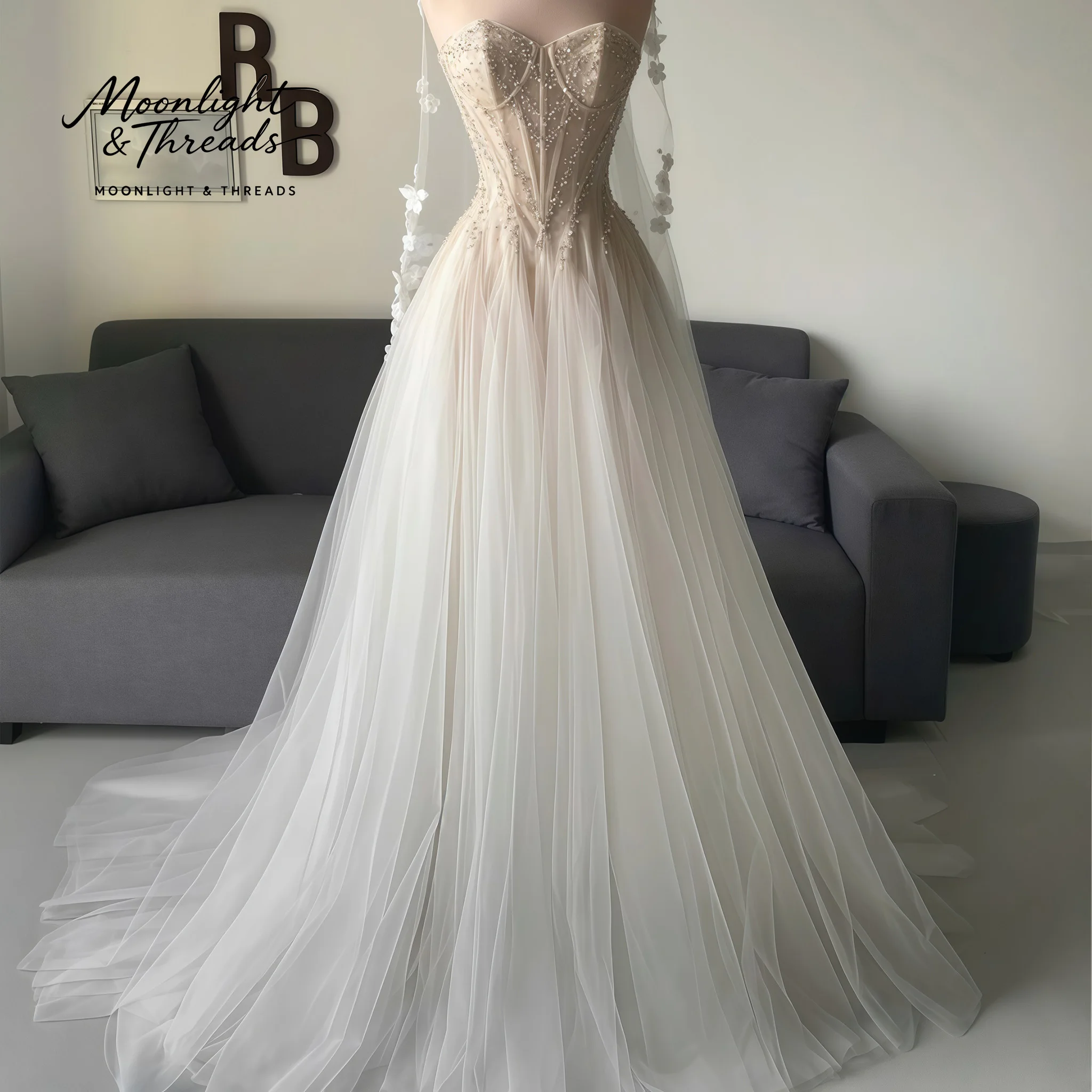 White strapless sleeveless A-line floor-length formal wedding gown featuring a boned bodice beadwork and draping
White strapless sleeveless A-line floor-length formal wedding gown featuring a boned bodice beadwork and draping