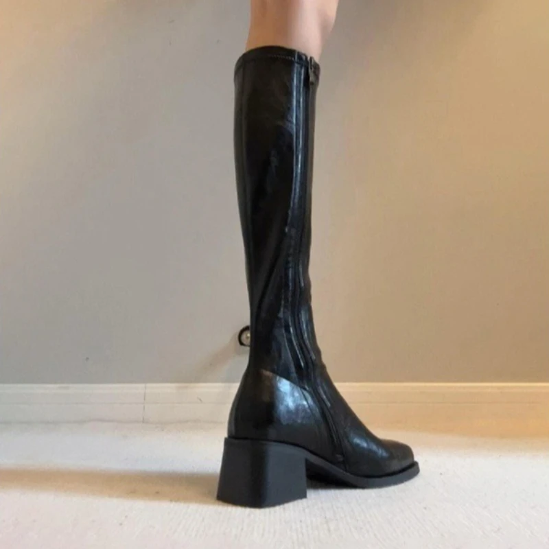Женские сапоги до колена из натуральной кожи на эластичной ткани в стиле пэчворк с боковой молнией, модные черные тонкие сапоги на толстом среднем каблуке с острым носком
Женские сапоги до колена из натуральной кожи на эластичной ткани в стиле пэчворк с боковой молнией, модные черные тонкие сапоги на толстом среднем каблуке с острым носком
