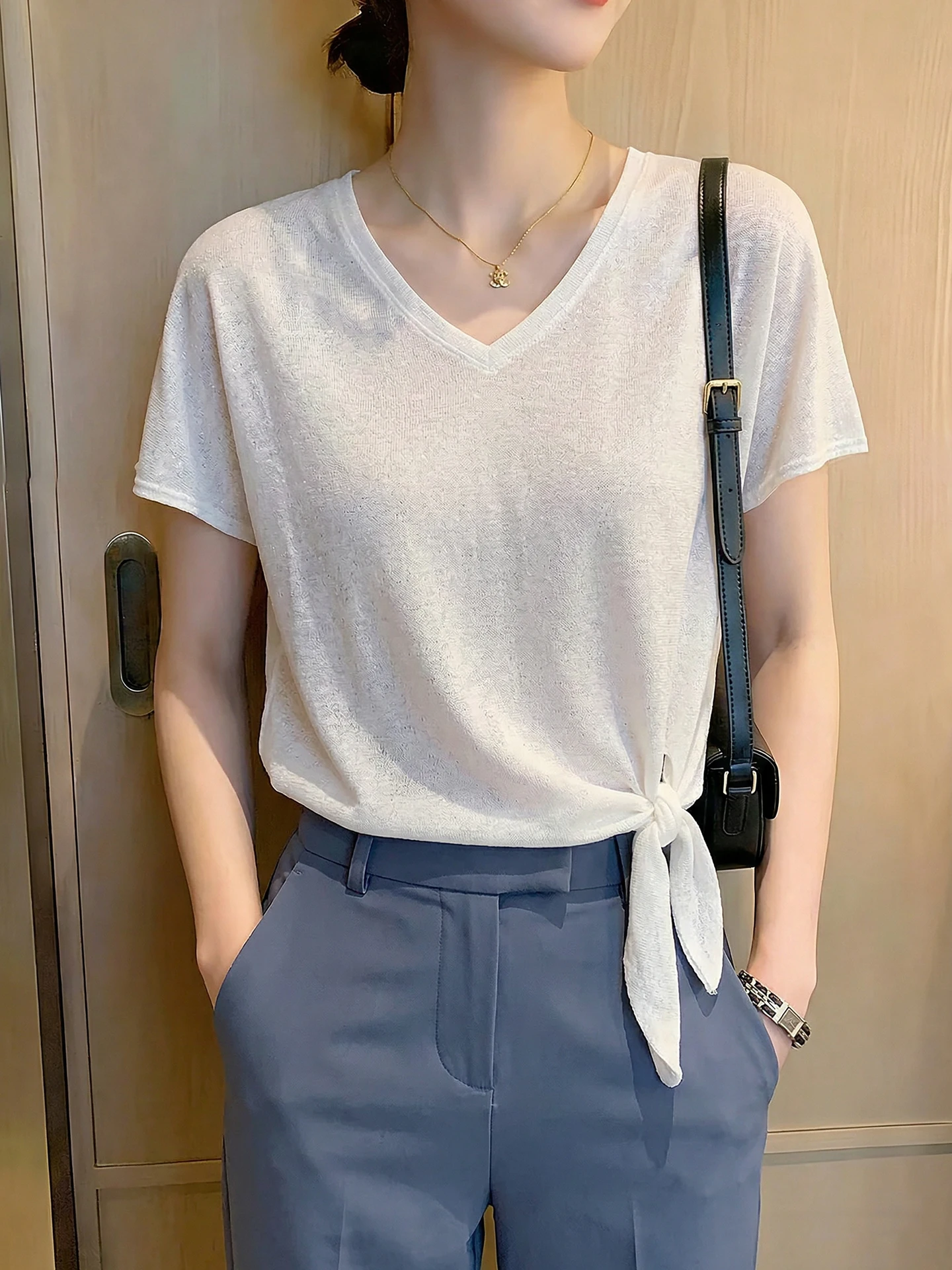 Simple Fashion V-Neck Short Sleeve Knitted T-Shirt Summer 2026 Style Belt Design Slimming Casual Top for Women
Simple Fashion V-Neck Short Sleeve Knitted T-Shirt Summer 2026 Style Belt Design Slimming Casual Top for Women