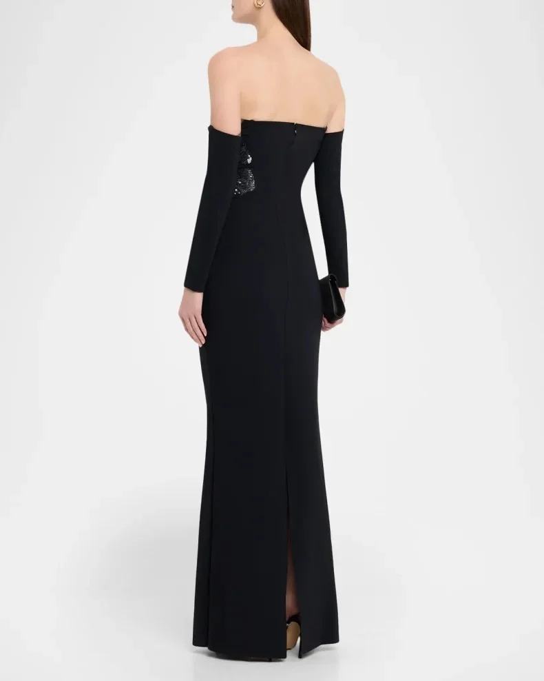 Black off-shoulder V-neck mermaid maxi gown with detachable long sleeves to flatter arms. Side 3D floral bead decoration, stretc
Black off-shoulder V-neck mermaid maxi gown with detachable long sleeves to flatter arms. Side 3D floral bead decoration, stretc