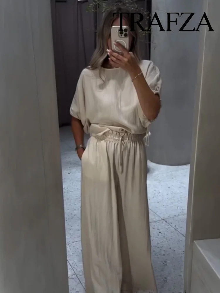 TRAFZA Women Solid Elegant Button Puff Sleeves Lace-up O-Neck Shirt+Slim High Waist Drawstring Pajama Style Pants 2-Piece Set
TRAFZA Women Solid Elegant Button Puff Sleeves Lace-up O-Neck Shirt+Slim High Waist Drawstring Pajama Style Pants 2-Piece Set