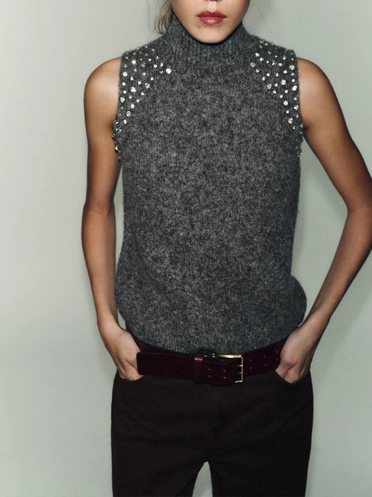 Новый женский модный и универсальный однотонный вязаный топ без рукавов в европейском стиле с украшениями из бисера
Новый женский модный и универсальный однотонный вязаный топ без рукавов в европейском стиле с украшениями из бисера