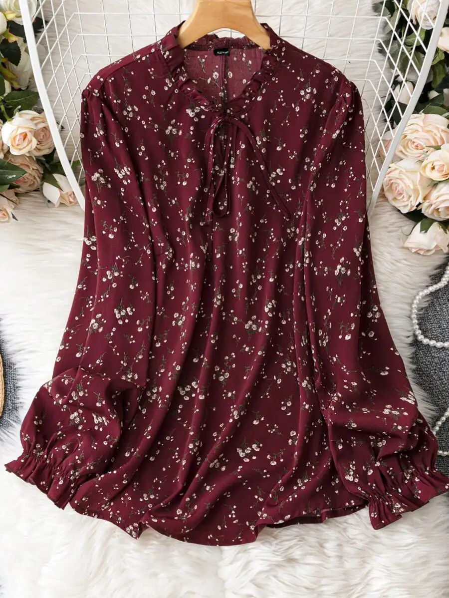 Burgundy Floral Print Long Sleeve Blouse with Ruffled Neck and Elastic Cuffs
Burgundy Floral Print Long Sleeve Blouse with Ruffled Neck and Elastic Cuffs