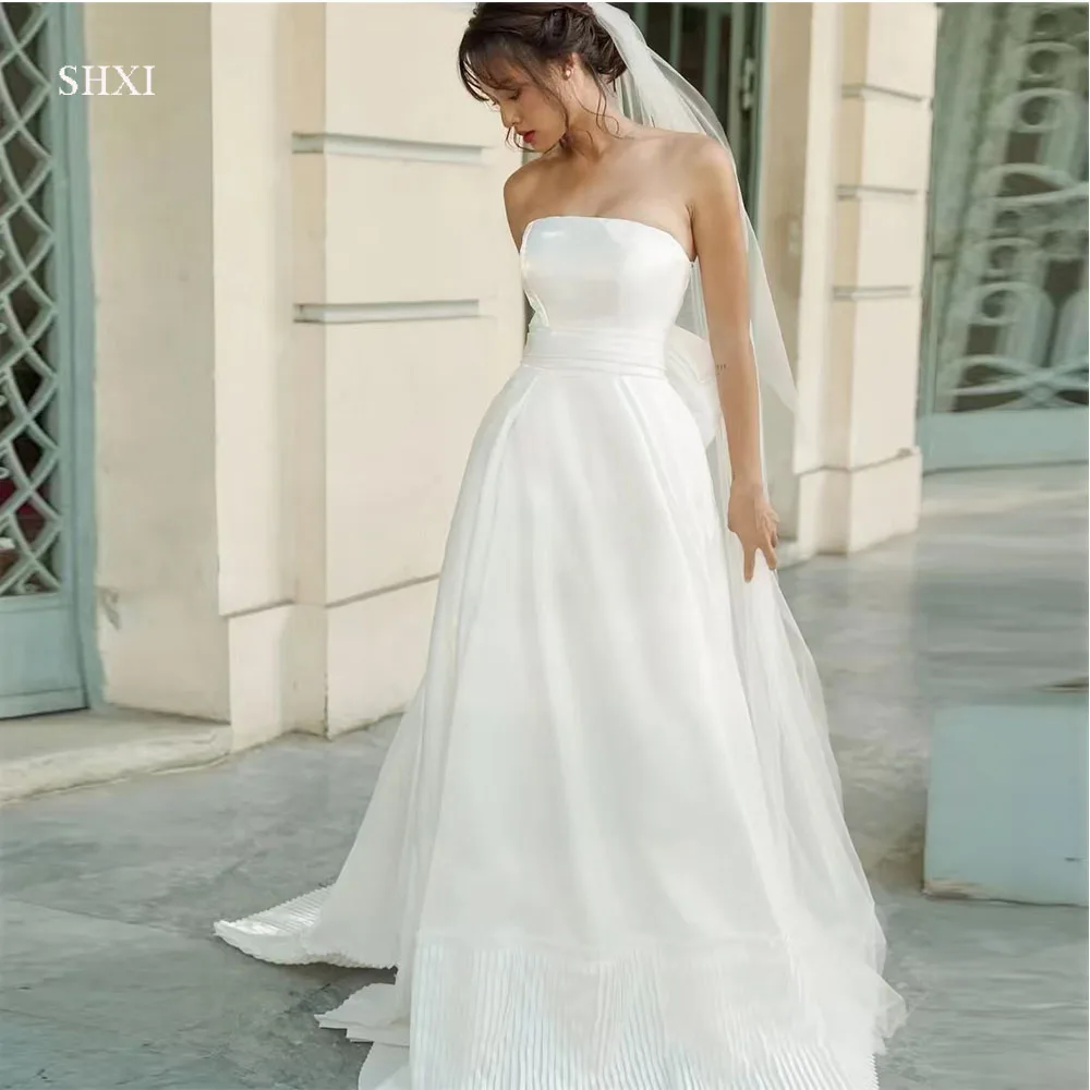 SHXI Modern Strapless Korea Wedding Dresses Customized Satin Pleats Layered Photo Shoot Dress Big Bow Backless Bridal Party Gown
SHXI Modern Strapless Korea Wedding Dresses Customized Satin Pleats Layered Photo Shoot Dress Big Bow Backless Bridal Party Gown