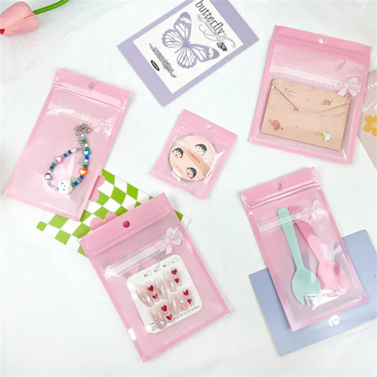 100PCS Pink Bow Ziplock Flat Plastic Packaging Bag DIY Clear Jewelry Cosmetics Nail Beauty Puffs Wristband Gifts Storage Pouches
100PCS Pink Bow Ziplock Flat Plastic Packaging Bag DIY Clear Jewelry Cosmetics Nail Beauty Puffs Wristband Gifts Storage Pouches