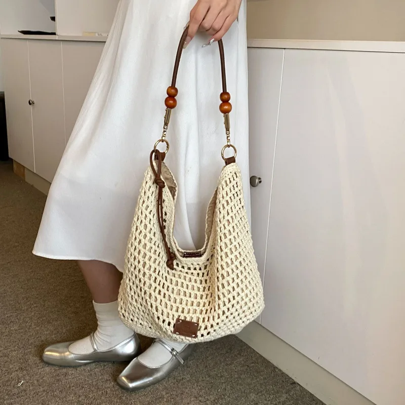 Summer foreign style hollow woven tote bag women's new casual portable knitted bag large-capacity messenger bag
Summer foreign style hollow woven tote bag women's new casual portable knitted bag large-capacity messenger bag