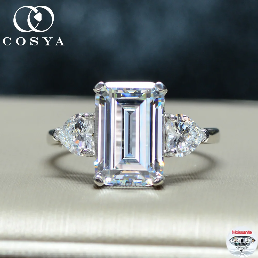 Кольцо COSYA с муассанитом изумрудной огранки 4.5 карата (8*11 мм), серебро S925, с тремя камнями, обручальное, для женщин, сверкающее, подарочное ювелирное украшение
Кольцо COSYA с муассанитом изумрудной огранки 4.5 карата (8*11 мм), серебро S925, с тремя камнями, обручальное, для женщин, сверкающее, подарочное ювелирное украшение