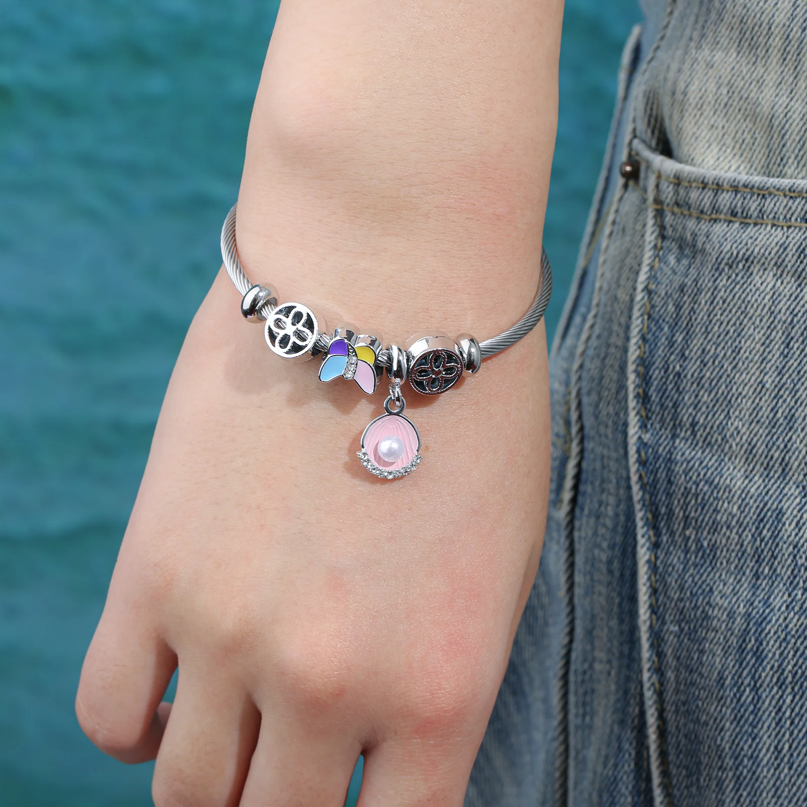 Silver Tone Charm Bangle with Colorful Butterfly and Pink Shell Pendant for Women
Silver Tone Charm Bangle with Colorful Butterfly and Pink Shell Pendant for Women