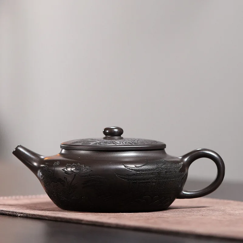 Handmade Yixing Ore Yellow Purple Clay Pot Carving and Gas Flat Morning Teapot Cover inside Lettering High-Capacity Ball Hole
Handmade Yixing Ore Yellow Purple Clay Pot Carving and Gas Flat Morning Teapot Cover inside Lettering High-Capacity Ball Hole