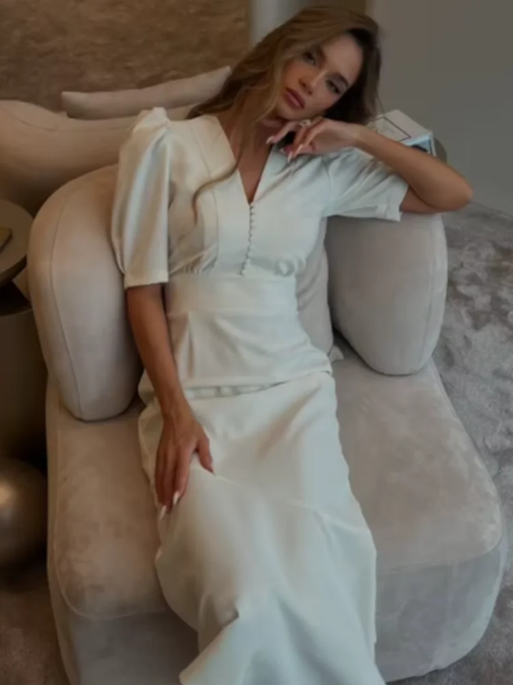 Women's Solid White Midi Dress V-neck Puff Sleeve Button Detail Fitted Bodice Flared Mermaid Hem 2026 Casual Office Style Gown
Women's Solid White Midi Dress V-neck Puff Sleeve Button Detail Fitted Bodice Flared Mermaid Hem 2026 Casual Office Style Gown