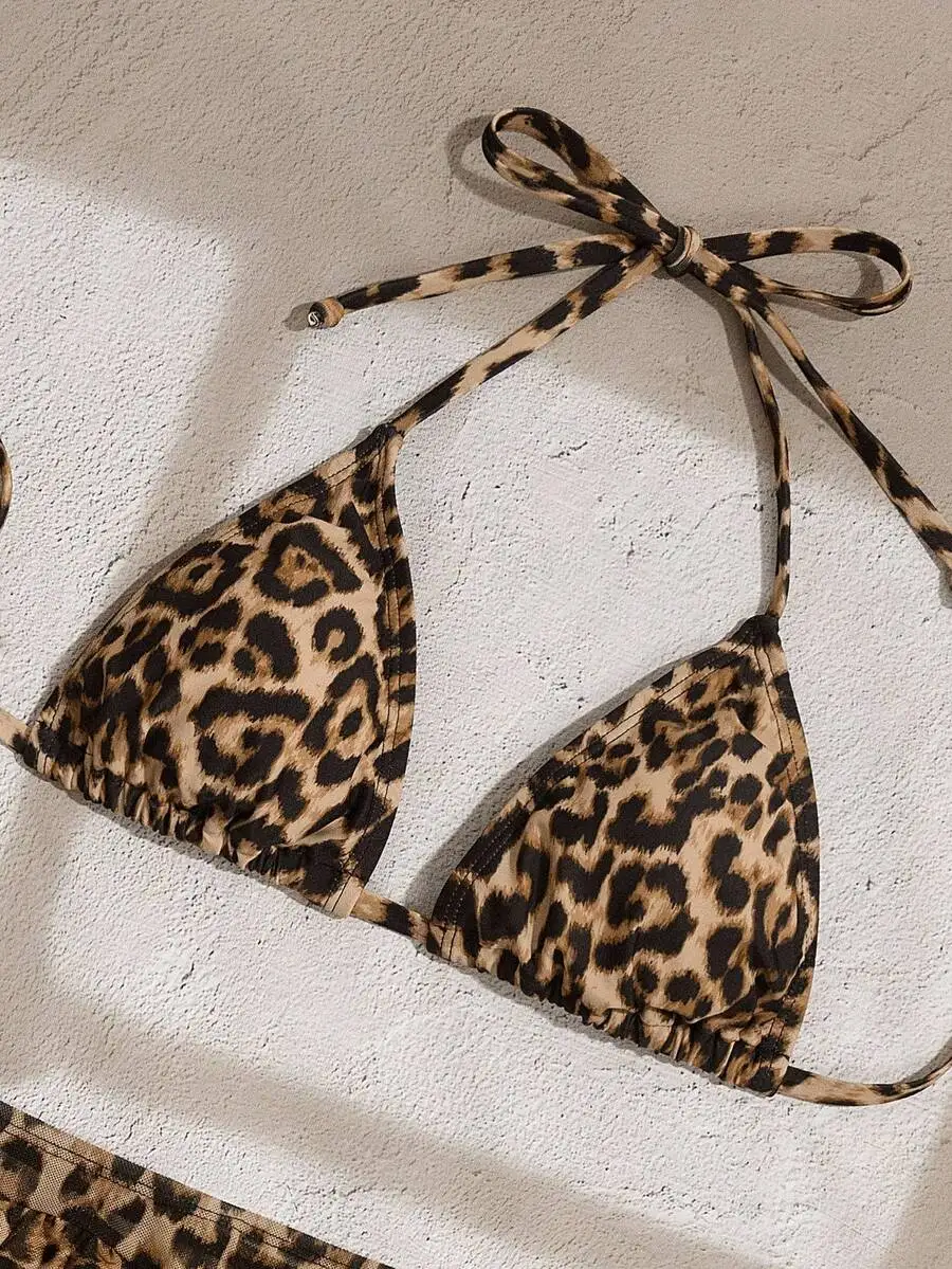 Leopard Print Halter Tie Triangle Bikini Top With Ruffle Trim
Leopard Print Halter Tie Triangle Bikini Top With Ruffle Trim