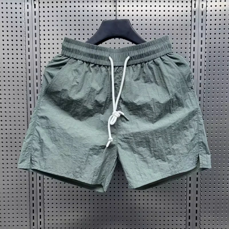 2025 summer thin ice silk shorts, loose and fashionable casual three part pants, drawstring men's solid color beach pants
2025 summer thin ice silk shorts, loose and fashionable casual three part pants, drawstring men's solid color beach pants