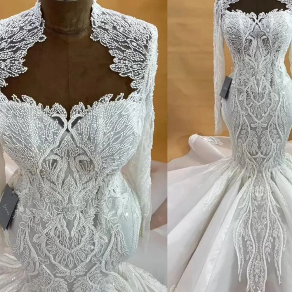 Aso Ebi Свадебное платье русалки цвета слоновой кости для невесты, расшитое блестками, тюль, прозрачный вырез, длинные рукава, роскошные свадебные платья, платья размера плюс 2025
Aso Ebi Свадебное платье русалки цвета слоновой кости для невесты, расшитое блестками, тюль, прозрачный вырез, длинные рукава, роскошные свадебные платья, платья размера плюс 2025