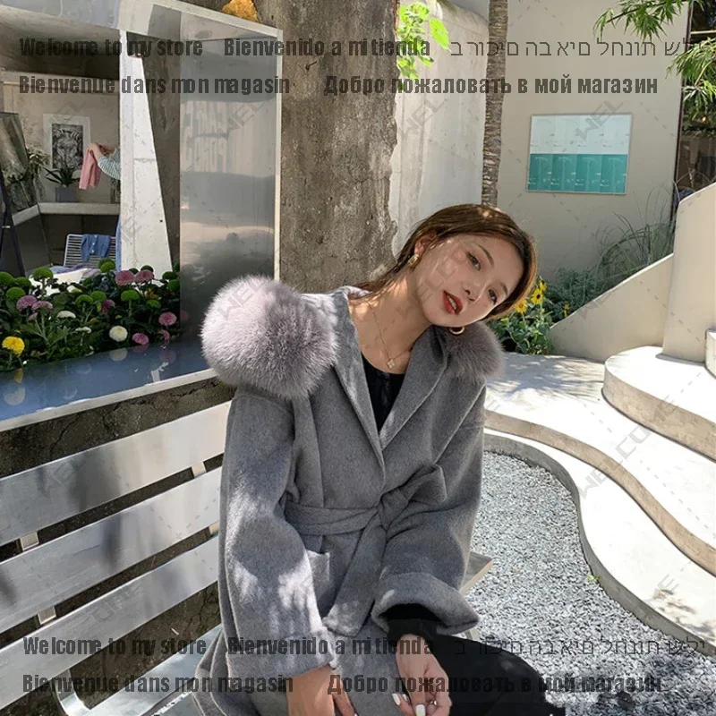 Women's Mid-length Woolen Jacket Outerwear Streetwear Luxury Loose Fox Fur Collar Hooded Wool Cashmere Coat 1
Women's Mid-length Woolen Jacket Outerwear Streetwear Luxury Loose Fox Fur Collar Hooded Wool Cashmere Coat 1