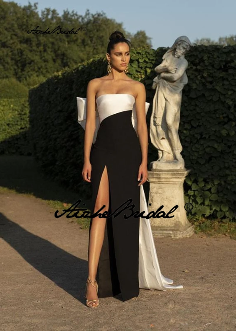 Простое черно-белое контрастное атласное вечернее платье с большим бантом и высоким разрезом для выпускного вечера премиум-класса 
Простое черно-белое контрастное атласное вечернее платье с большим бантом и высоким разрезом для выпускного вечера премиум-класса