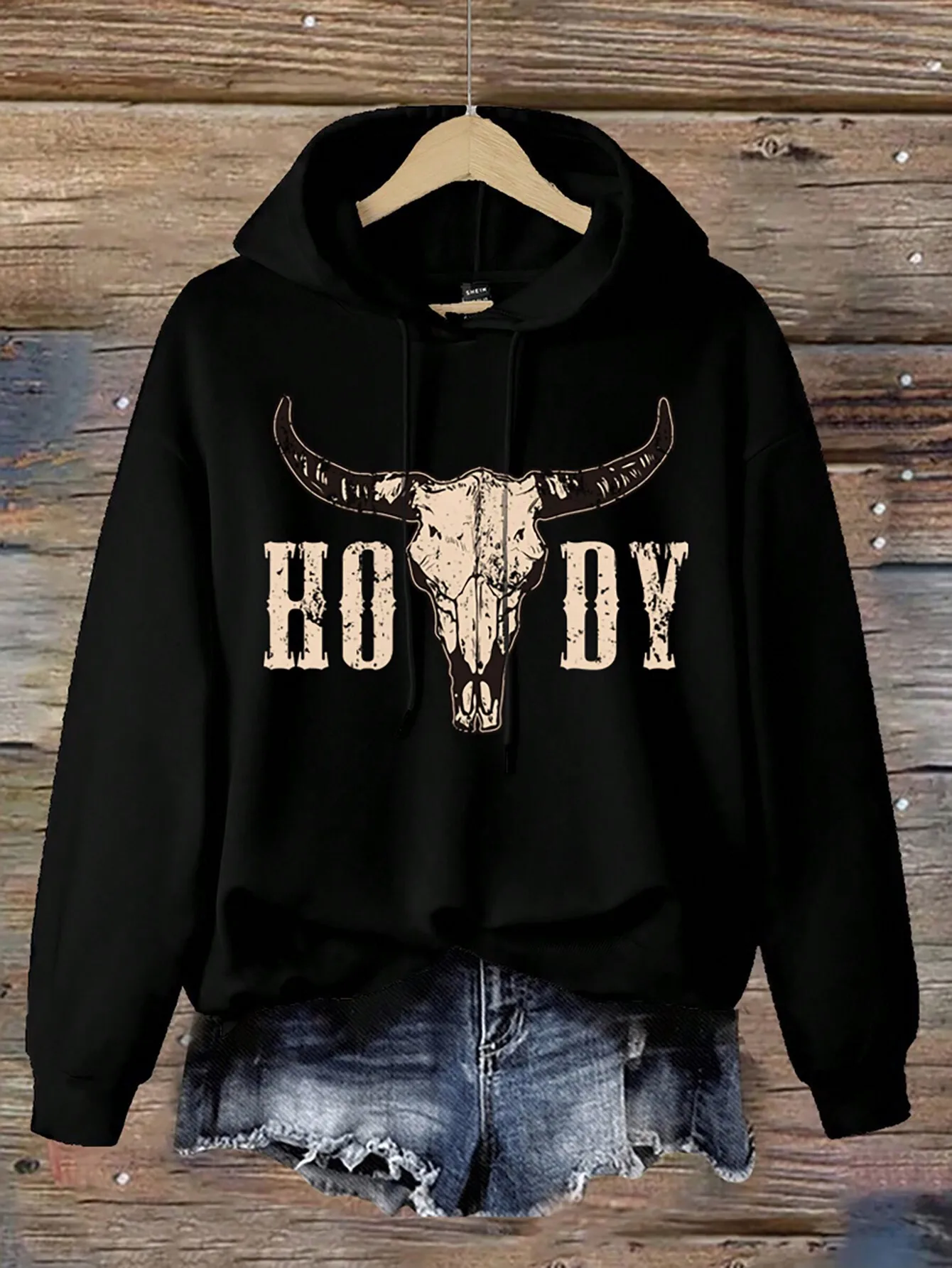 Черная свободная толстовка с принтом в виде состаренного черепа быка для женщин
Черная свободная толстовка с принтом в виде состаренного черепа быка для женщин