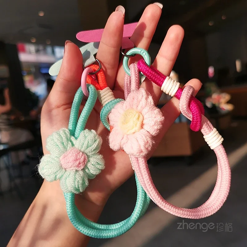 Шерстяной ремешок для мобильного телефона с цветочным плетением, короткий, модный женский ремешок для путешествий на открытом воздухе, ручной веревочный ремешок с защитой от потери
Шерстяной ремешок для мобильного телефона с цветочным плетением, короткий, модный женский ремешок для путешествий на открытом воздухе, ручной веревочный ремешок с защитой от потери