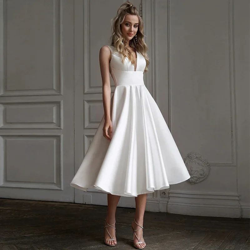 Wedding Dresses Backless A Line Tea Length Midi Wedding Gowns Customized Simple Bride Dress V Neck White Satin Sleeveless Short
Wedding Dresses Backless A Line Tea Length Midi Wedding Gowns Customized Simple Bride Dress V Neck White Satin Sleeveless Short