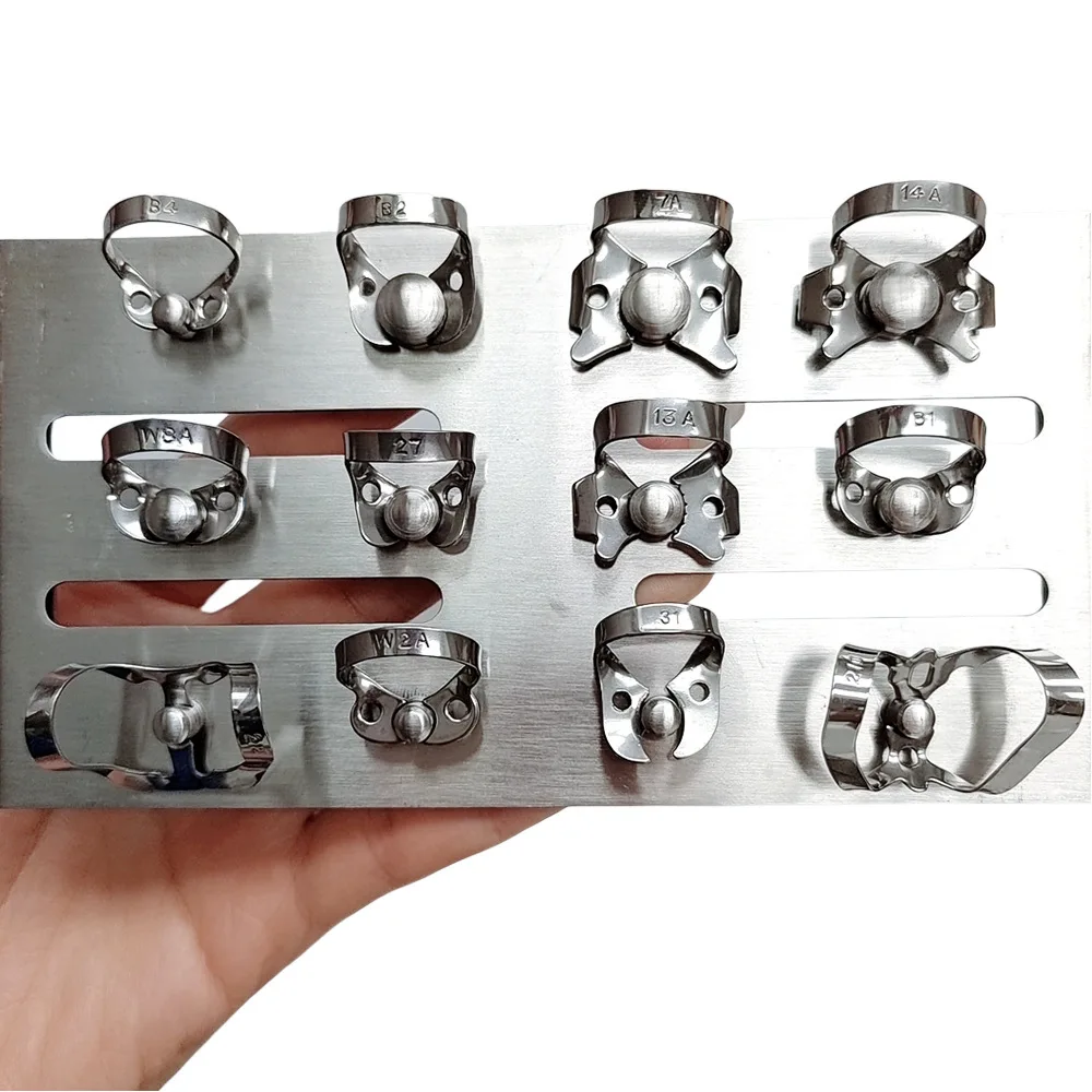 Dental Rubber Dam Clamps with Holder Rack, Natural Stainless Steel & Blue Coated, Autoclavable Reusable Endodontic Clips for Den
Dental Rubber Dam Clamps with Holder Rack, Natural Stainless Steel & Blue Coated, Autoclavable Reusable Endodontic Clips for Den