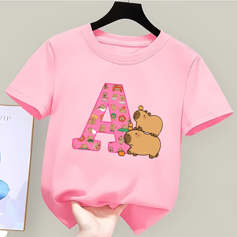Capybara Kids T-shirt Girls Cartoon Capibara Letter A-Z Polyester Tees Cute Kawaii Summer Short Sleeve Tops Child Clothes Gifts
Capybara Kids T-shirt Girls Cartoon Capibara Letter A-Z Polyester Tees Cute Kawaii Summer Short Sleeve Tops Child Clothes Gifts