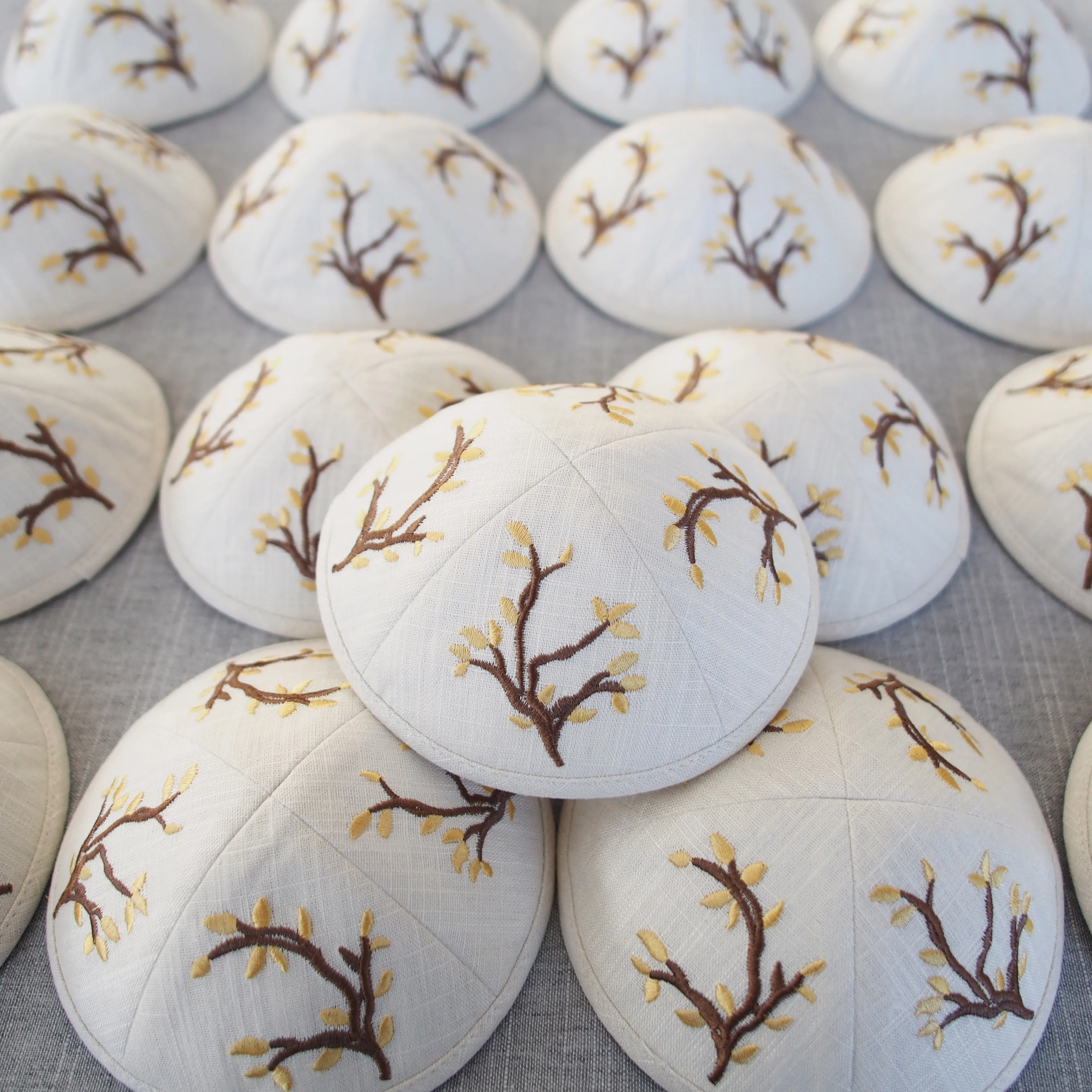 Ivory white linen kippah with custom embroidery and digital printing, suitable for Jewish coming-of-age ceremonies and weddings.
Ivory white linen kippah with custom embroidery and digital printing, suitable for Jewish coming-of-age ceremonies and weddings.