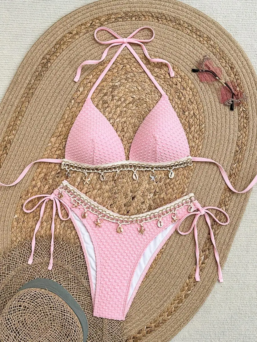 Pink Textured Halter Bikini Featuring Crochet Seashell Fringe, Adjustable Neck Tie And Side Drawstring Bottoms For Summer Beach
Pink Textured Halter Bikini Featuring Crochet Seashell Fringe, Adjustable Neck Tie And Side Drawstring Bottoms For Summer Beach