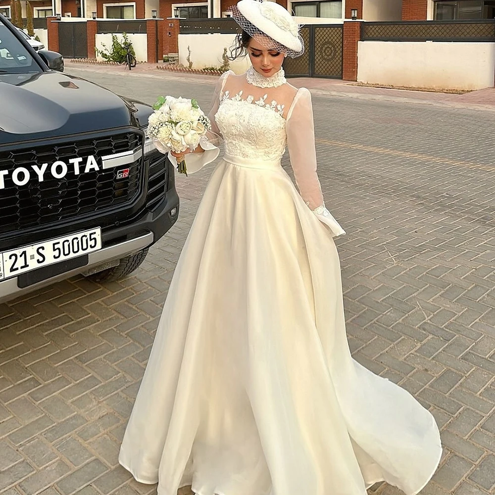Customized Beige High Neck Satin Wedding Dress ILLUSION Full Sleeves With Appliques A-line Floor Length Birde Gown For Wedding
Customized Beige High Neck Satin Wedding Dress ILLUSION Full Sleeves With Appliques A-line Floor Length Birde Gown For Wedding