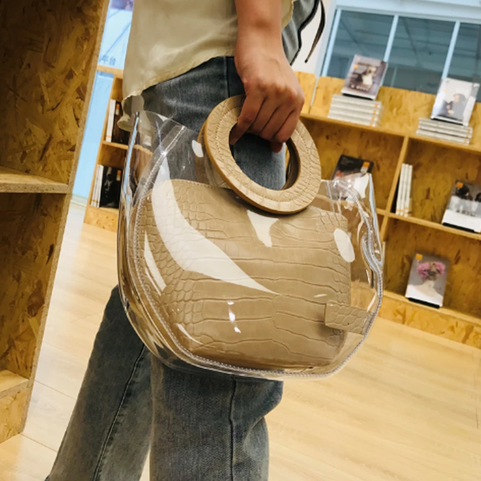 PVC Clear Transparent Jelly Bag New Top Handle Bag High Quality Women Handbag Portable Beach Bag PVC Bucket Bag
PVC Clear Transparent Jelly Bag New Top Handle Bag High Quality Women Handbag Portable Beach Bag PVC Bucket Bag