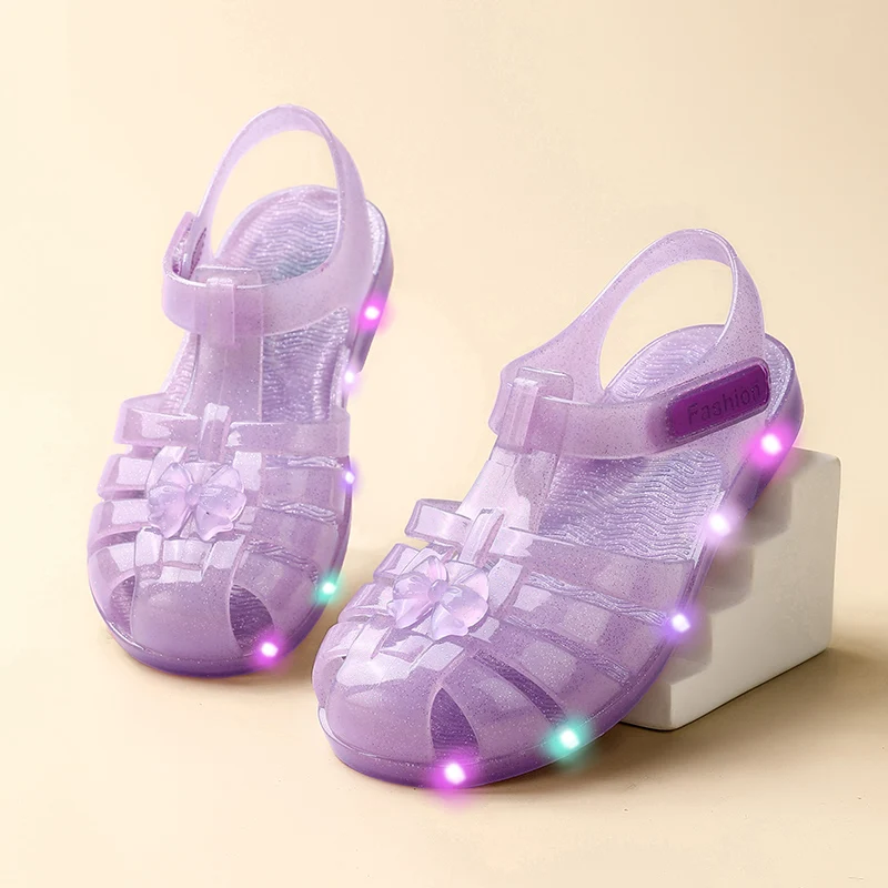 A pair of children's summer mesh sandals, jelly material illuminated shoes, comfortable soft sole anti-slip beach shoes, HL-065
A pair of children's summer mesh sandals, jelly material illuminated shoes, comfortable soft sole anti-slip beach shoes, HL-065