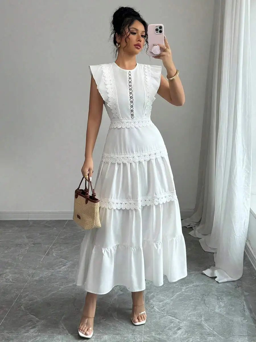 White Sleeveless Round Neck Midi Dress With Tiered Flowy Skirt And Embroidered Floral Lace Trim Details
White Sleeveless Round Neck Midi Dress With Tiered Flowy Skirt And Embroidered Floral Lace Trim Details