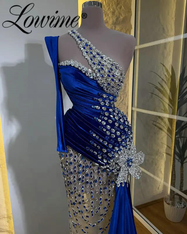 Королевские синие роскошные платья для выпускного вечера с кристаллами на одно плечо и длинными рукавами по индивидуальному заказу 2026 Иллюзионные свадебные вечерние платья для приема
Королевские синие роскошные платья для выпускного вечера с кристаллами на одно плечо и длинными рукавами по индивидуальному заказу 2026 Иллюзионные свадебные вечерние платья для приема